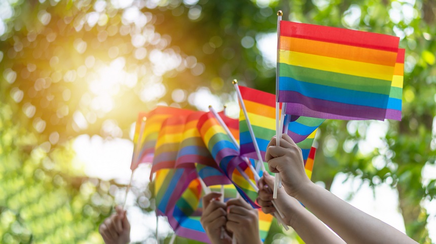 LGBT pride or LGBTQ+ gay pride with rainbow flag for lesbian, ga